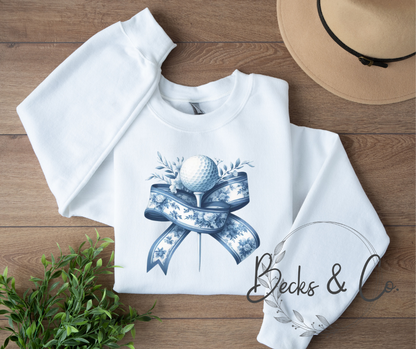Golf Ball and Tee with Blue Ribbon