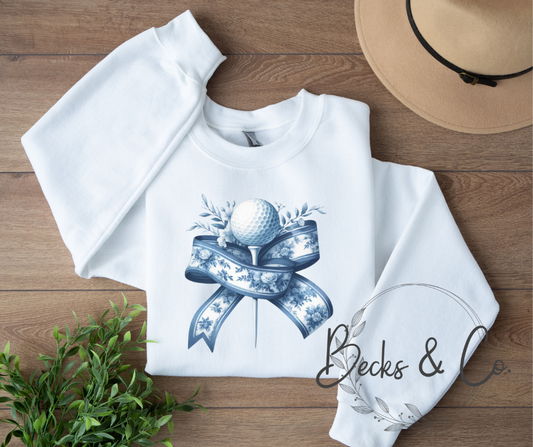 Golf Ball and Tee with Blue Ribbon